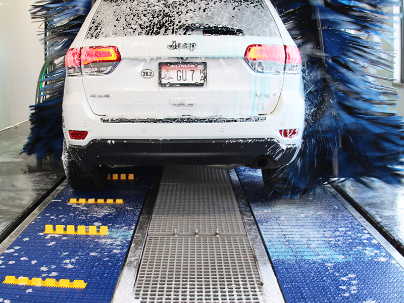 Conveyor belt outlet car wash